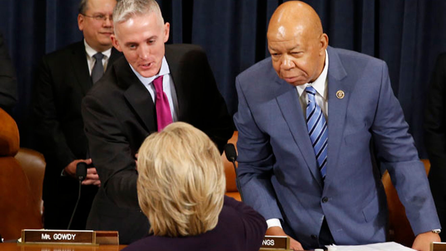 Oct 22, 2015: Democratic presidential candidate Hillary Clinton shakes hands with Committee Chairman Trey Gowdy (C) as ranking member Rep. Elijah Cummings (R) looks on as she arrives to testify before the House Select Committee on Benghazi about the attack on a U.S. diplomatic mission in Benghazi, Libya, on Capitol Hill in Washington.