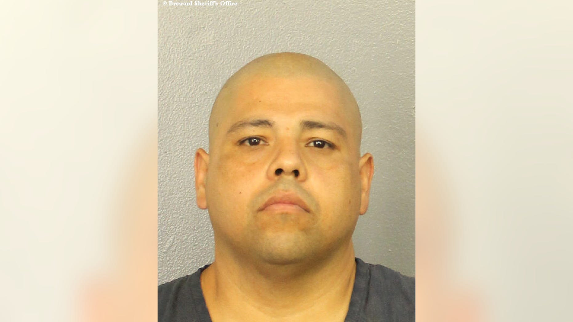 Leonard Benitez, 45, was arrested after he held an elderly couple hostage after asking to borrow a cup of salt, police said. (Broward Sheriff's Office)