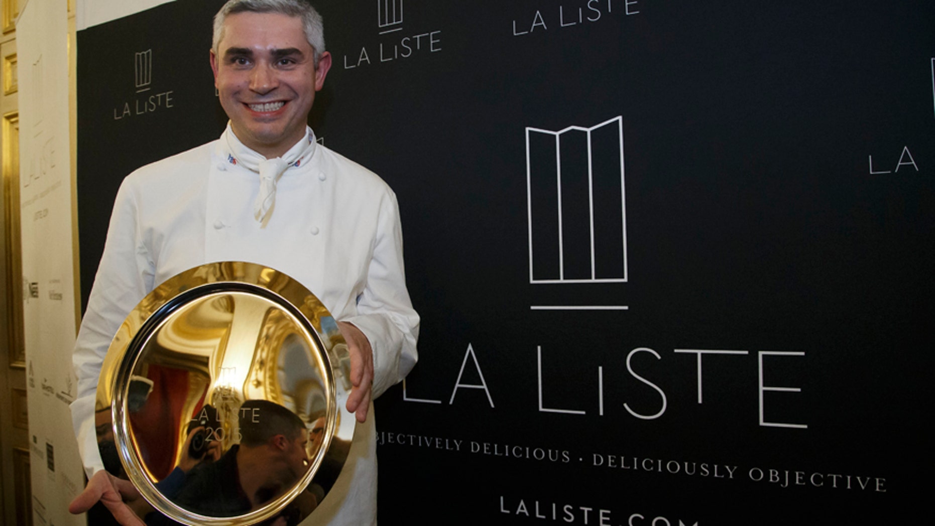 Dec. 17, 2015: French Swiss Chef Benoit Violier of the restaurant Hotel de Ville in Crissier, Switzerland, poses with his trophy for the best restaurant of the World during the award ceremony of "La Liste" (The List) at the French Foreign Ministry in Paris.