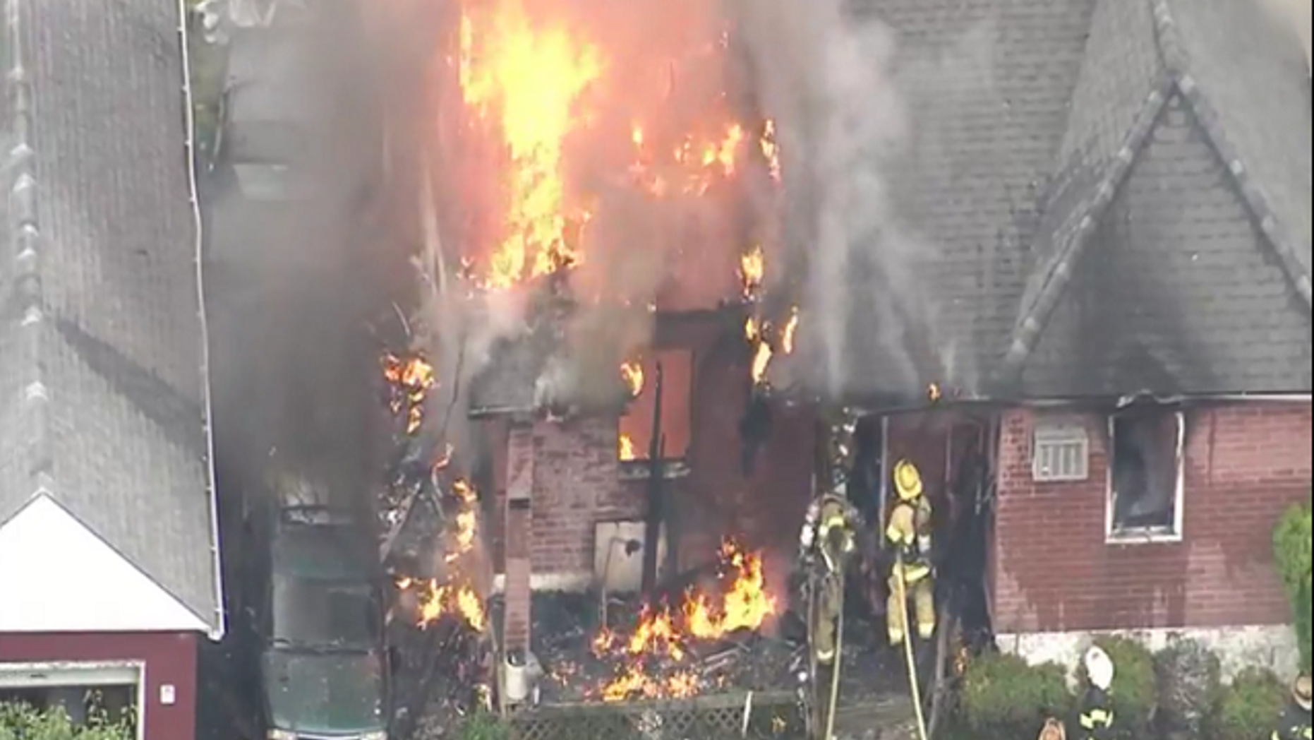 Firefighters trying to control the house fire in Bensalem, Pennsylvania.