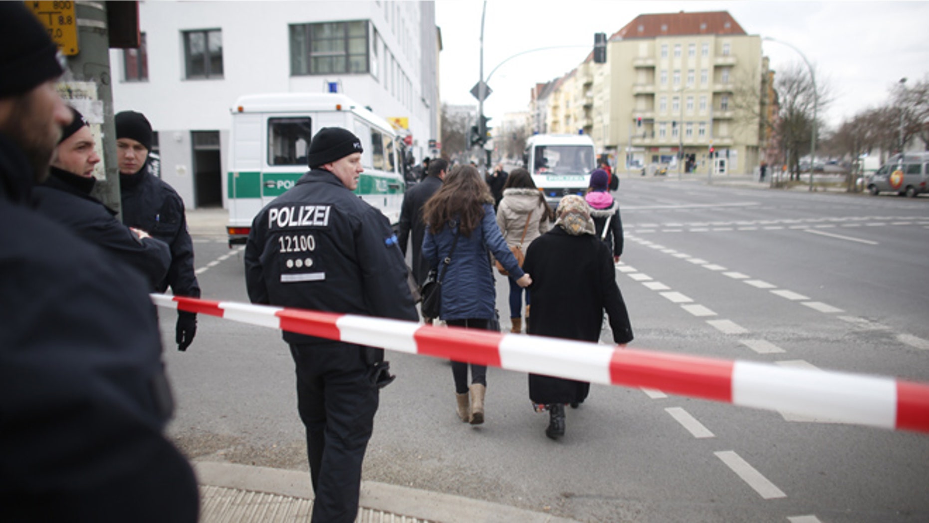 April 3, 2013: Police officers advise inhabitants to leave an area which had to be evacuated after a World War II bomb has been found at a building site near Berlin's main train station in Berlin. Police spokesman Thomas Neuendorf said the 220-pound bomb was found during construction work on Tuesday evening.
