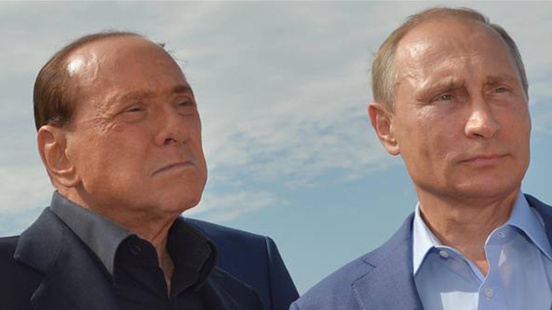 Russian president Vladimir Putin, right, and former Italian prime minister Silvio Berlusconi.