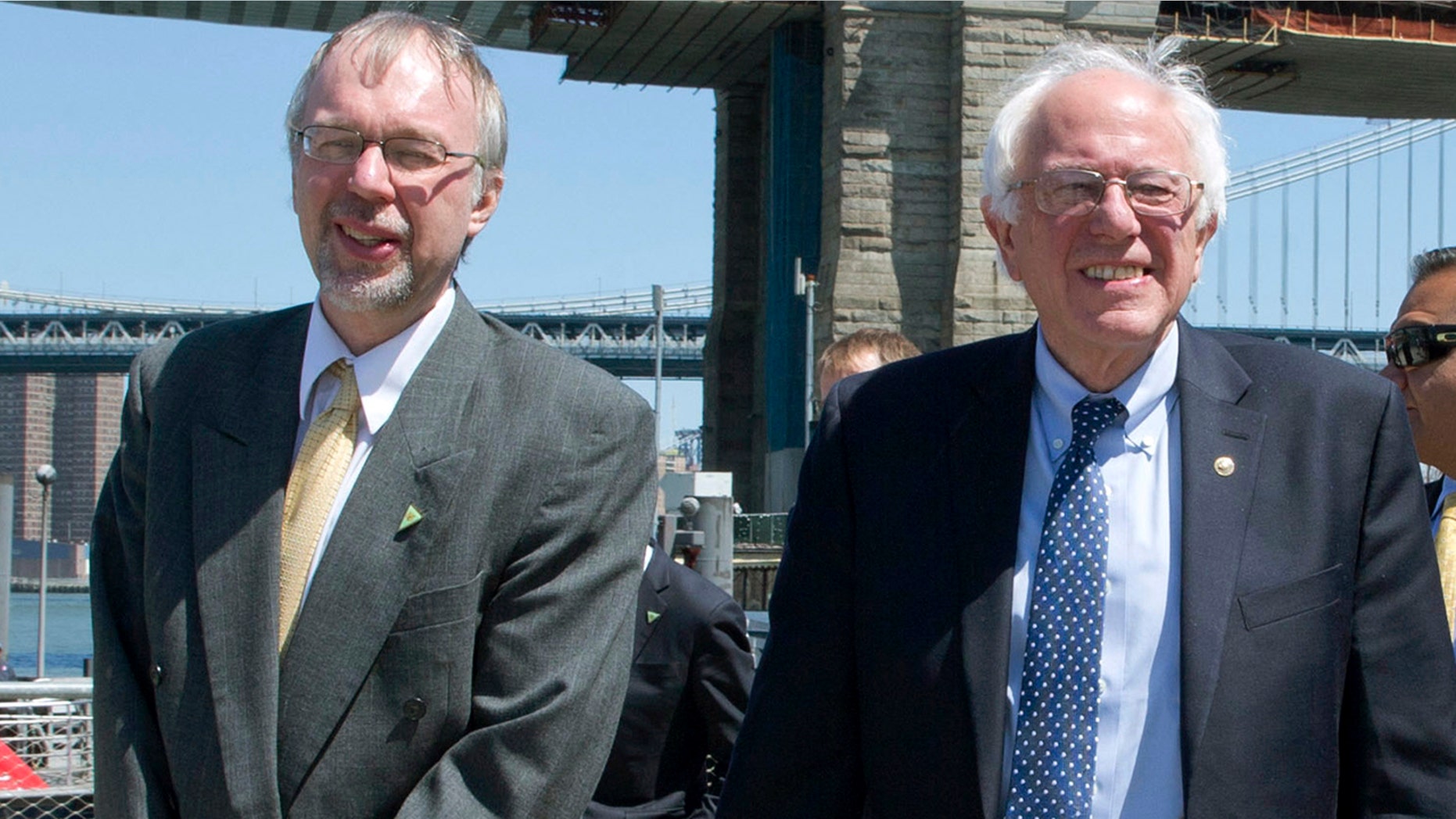 U.S. House candidate Levi Sanders, left, and U.S. Sen. Bernie Sanders, I-Vt., take a walk in Brooklyn Bridge Park in Brooklyn, N.Y., April 7, 2016.