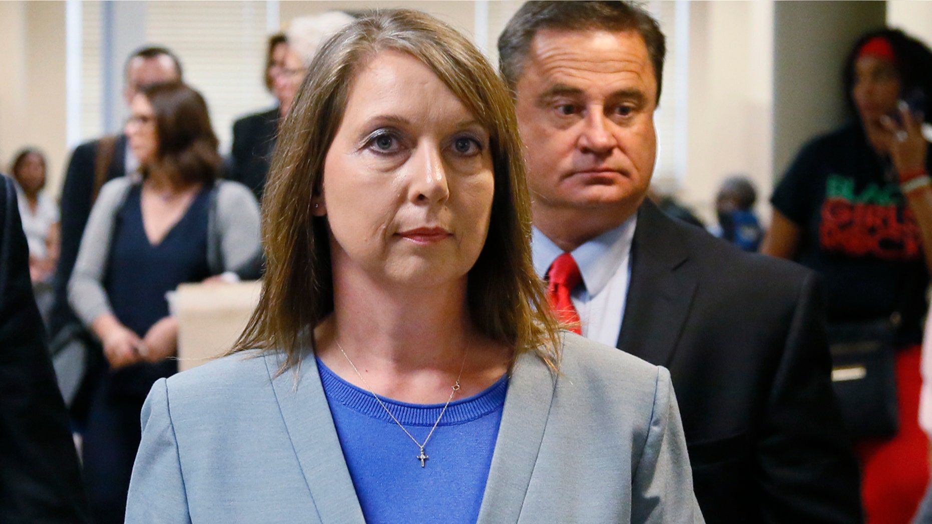Betty Shelby leaves the courtroom with her husband, Dave Shelby, right, after the jury in her case began deliberations in Tulsa, Okla., Wednesday, May 17, 2017. Shelby is charged with manslaughter in the shooting of Terence Crutcher, an unarmed black man. (AP Photo/Sue Ogrocki)