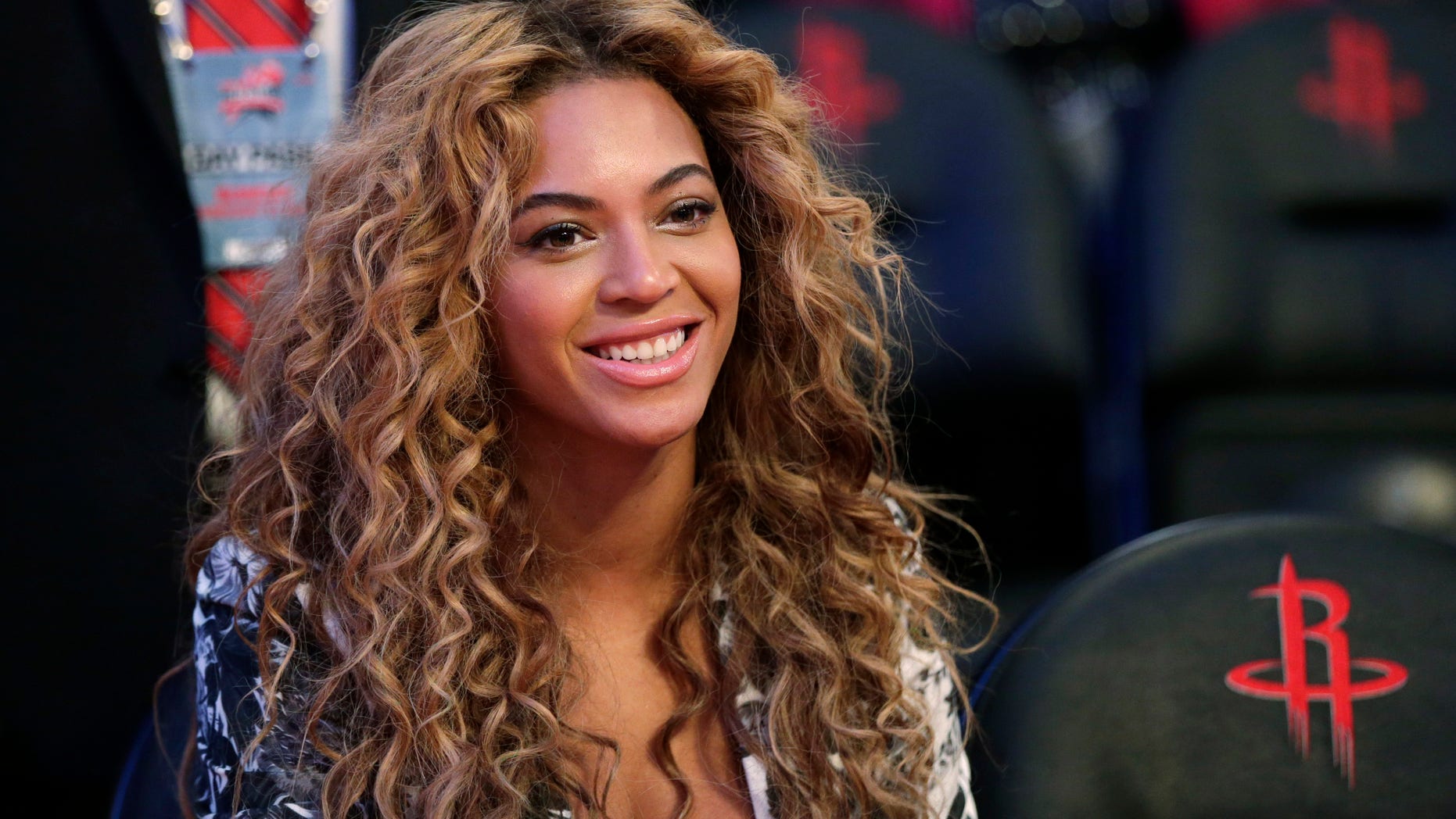 Feb. 17, 2013. Beyonce sits courtside before the NBA All-Star basketball game in Houston.