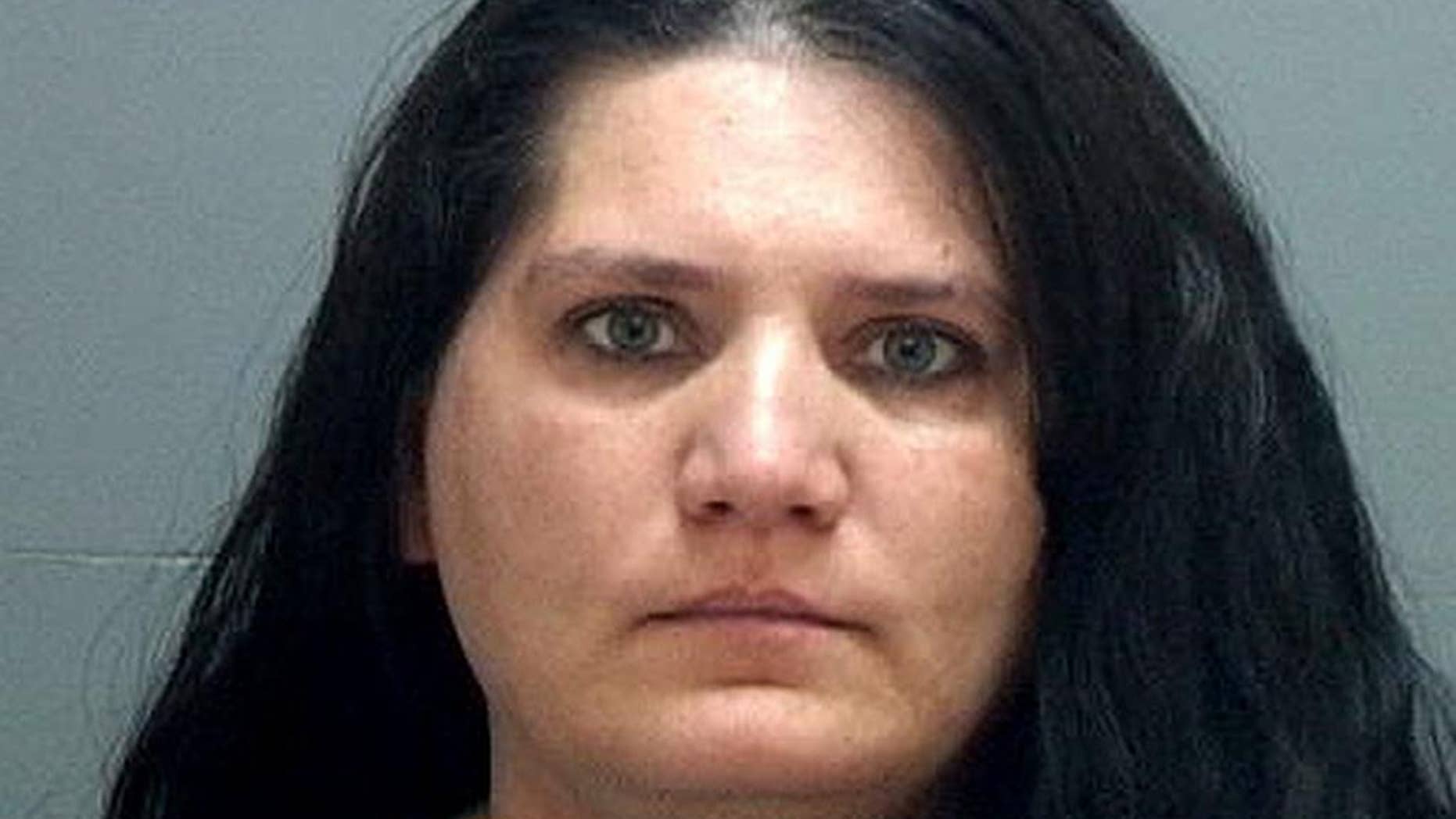 This undated booking photo provided by the Salt Lake County Jail shows Nannette Perkins who was arrested Sunday, April 16, 2017, at her Taylorsville home after Salt Lake City police received a tip about her identity. Perkins is believed to be the pajama-wearing robber in at least six bank robberies in the Salt Lake City area. (Salt Lake County Jail via AP)