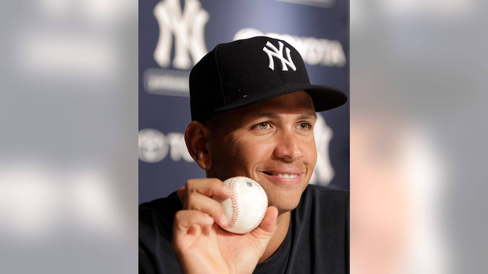 New York Yankees third baseman Alex Rodriguez holds up the baseball he hit for his his 600th career home run ball during a post-game a news conference after the Yankees 5-1 victory over the Toronto Blue Jays in a baseball game at Yankee Stadium on Wednesday, Aug. 4, 2010 in New York. (AP Photo/Kathy Willens)
