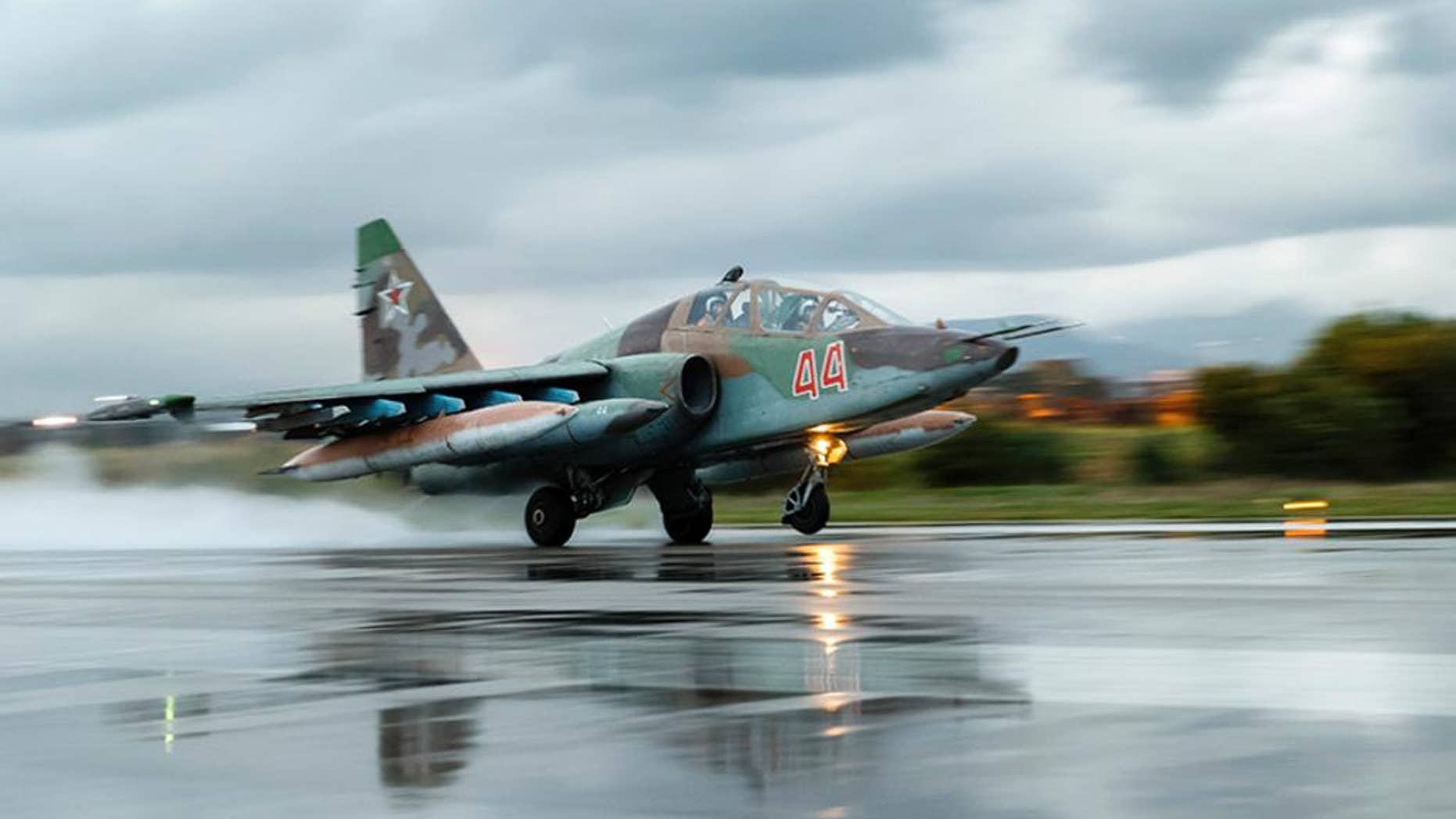 March 16, 2016: A Russian Su-25 ground attack jet takes off at Hemeimeem Air Base in Syria.