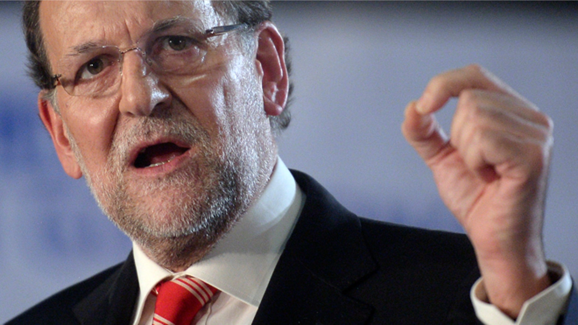 Spain's Prime Minister Mariano Rajoy gestures during his speech in Barcelona, Spain, Saturday, Nov. 29, 2014. Spains prime minister has visited the northern region of Catalonia 20 days after its government held an informal, nonbinding poll asking residents if they favored splitting from Spain. Rajoy, who was surrounded by many of his Cabinet ministers, said two-thirds of Catalans had not turned out to vote in the consultation and that the regional governments international propaganda operation had fallen apart noiselessly and without clatter". Catalan officials said out of 6.3 million potential voters, 2.3 million cast ballots, with most favoring secession. (AP Photo/Manu Fernandez)