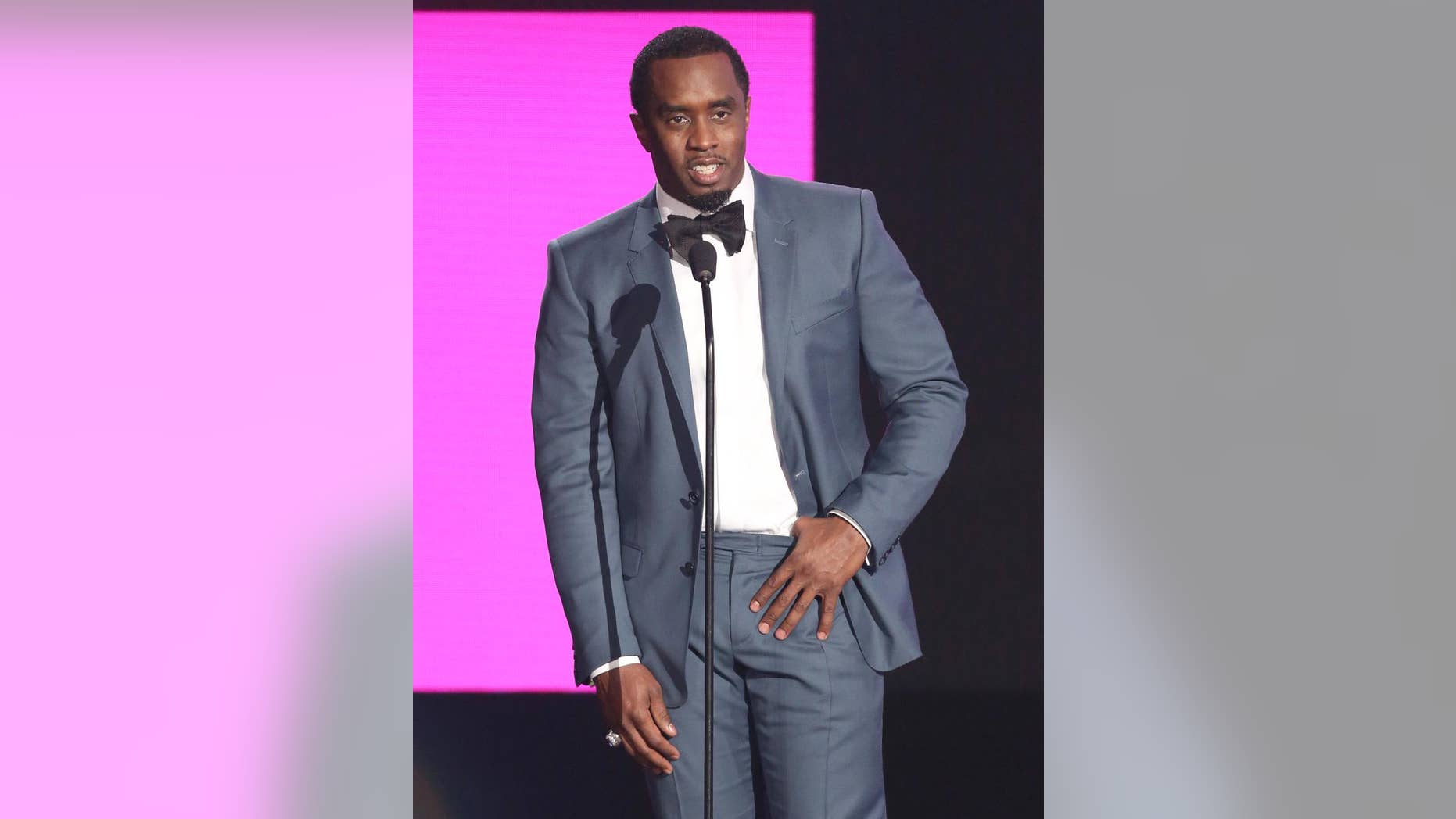 FILE - In this Nov. 22, 2015, file photo, Sean "Diddy" Combs presents the award for best collaboration of the year at the American Music Awards in Los Angeles. Combs, the founder of Capital Preparatory Harlem Charter School, announced Monday, March 28, 2016, that the school will open in the fall of 2016. (Photo by Matt Sayles/Invision/AP, File)