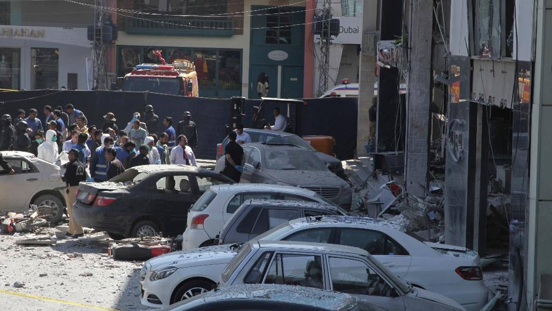 Police cordon off the area of explosion in Lahore, Pakistan, Thursday, Feb. 23, 2017. A Pakistani provincial minister says an explosion has killed at least eight people in the eastern city of Lahore. The violence is the latest in a string of brazen suicide bombings and other attacks over the past two weeks that have killed over 125 people. The attacks have been claimed by an array of militant groups, including the Islamic State group and a splinter Taliban faction, and have prompted a countrywide crackdown on militants. (AP Photo/K.M. Chaudary)
