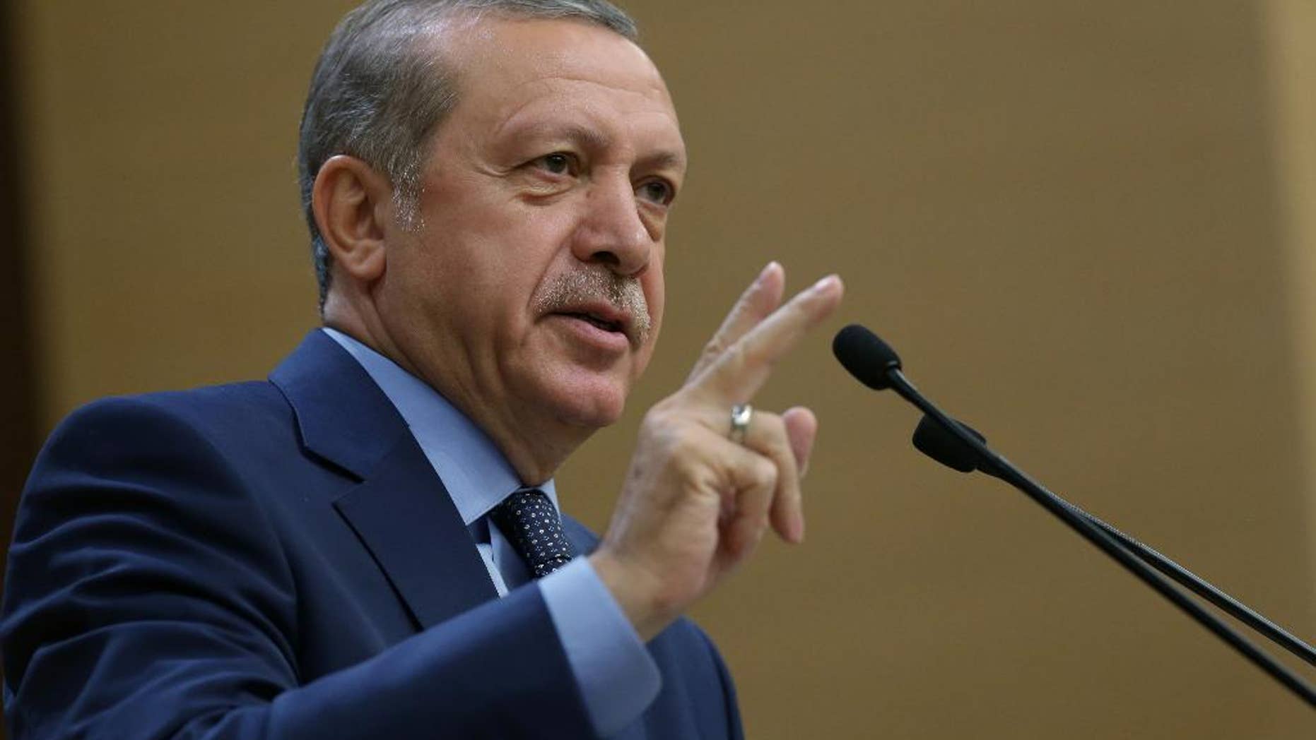 Turkey's President Recep Tayyip Erdogan addresses a group of local administrators in Ankara, Turkey, Thursday, Sept. 29, 2016. Erdogan hinted on Thursday that the three-month state of emergency declared following the failed July 15 coup could be extended to over a year. Erdogan dismissed criticism over plans for Turkey to prolong the state of emergency, saying no one should determine a "calendar or roadmap" for Turkey. (Murat Cetinmuhurdar, Prime Ministry Press Service, Pool via AP Photo)