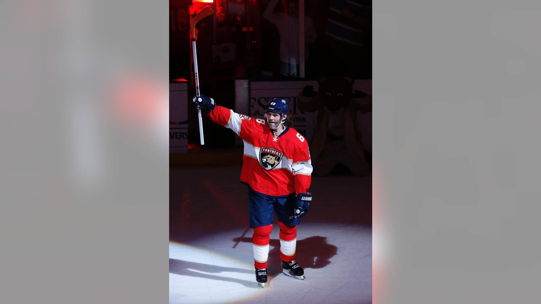 Florida Panthers right wing Jaromir Jagr (68) acknowledges the fans after the NFL hockey game against the Buffalo Sabres, Tuesday, Dec. 20, 2016, in Sunrise, Fla. Jagr tied Mark Messier for 2nd pace overall in NHL scoring with 1,887 points. The Panthers defeated the Sabres 4-3 in a shoot out. (AP Photo/Joel Auerbach)