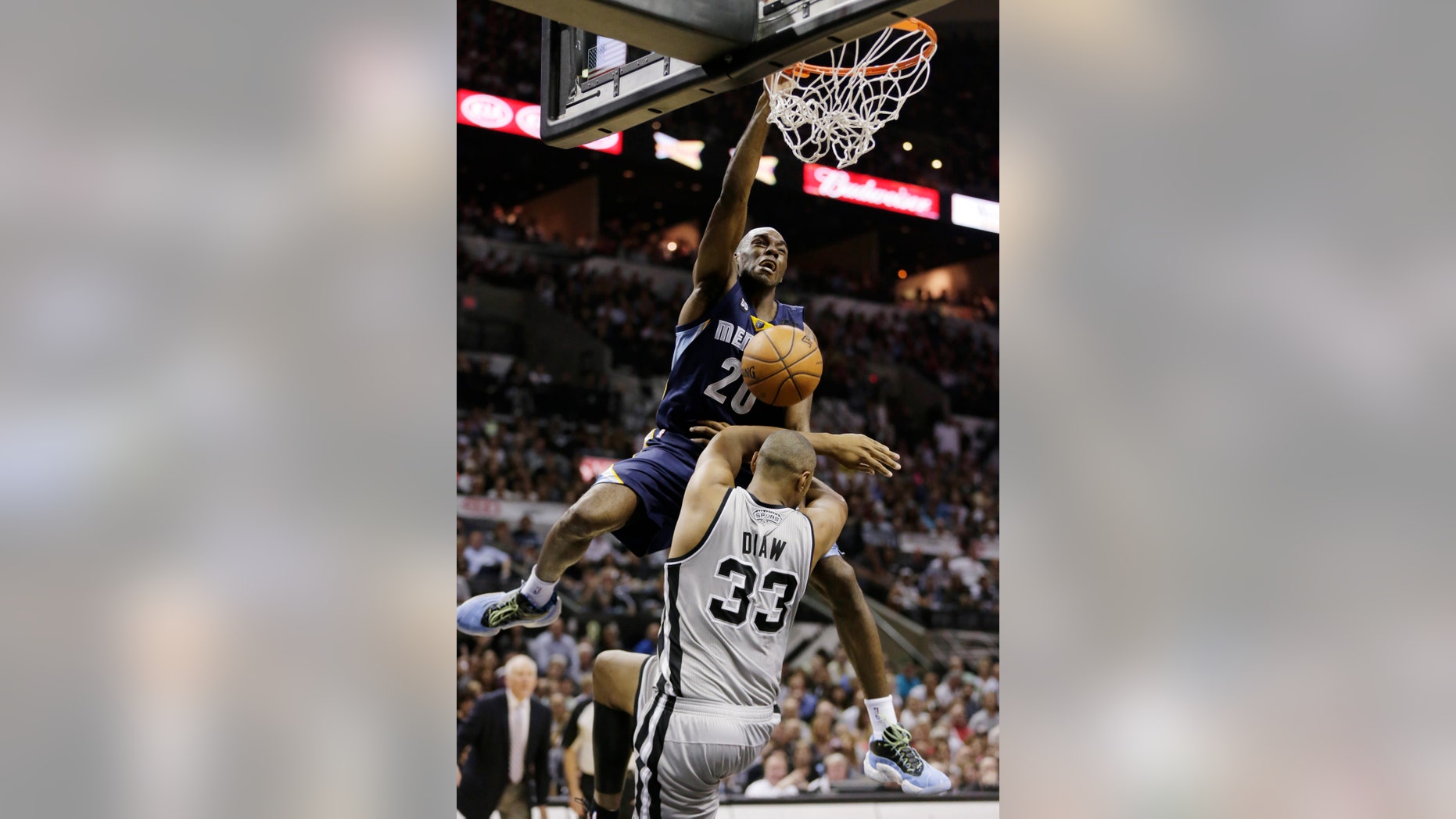 Memphis Grizzlies' Quincy Pondexter dunks against San Antonio Spurs' Boris Diaw (33), of France, during the second half in Game 2 of the Western Conference finals NBA basketball playoff series, Tuesday, May 21, 2013, in San Antonio. (AP Photo/Eric Gay)
