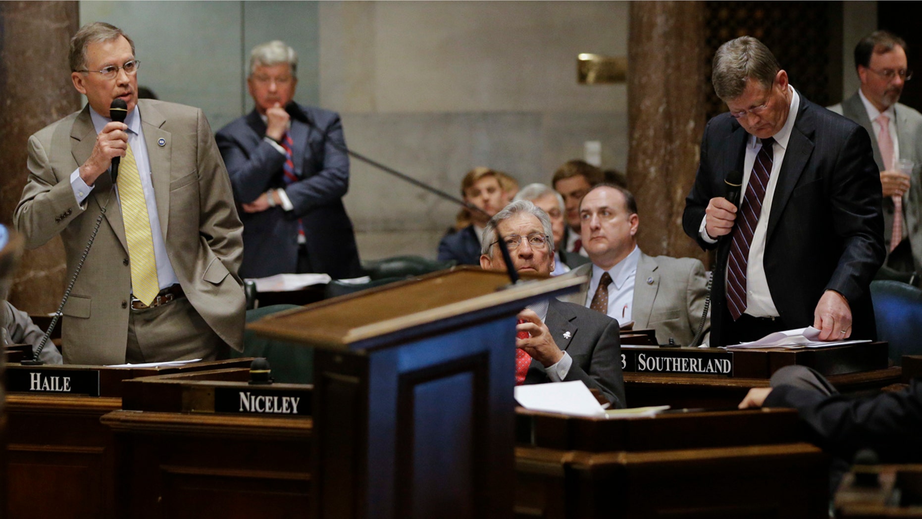 April 4, 2016: Sen. Ferrell Haile, R-Gallatin, left, speaks during debate on a bill by Sen. Steve Southerland, R-Morristown, front right, to make the Holy Bible the official book of Tennessee.