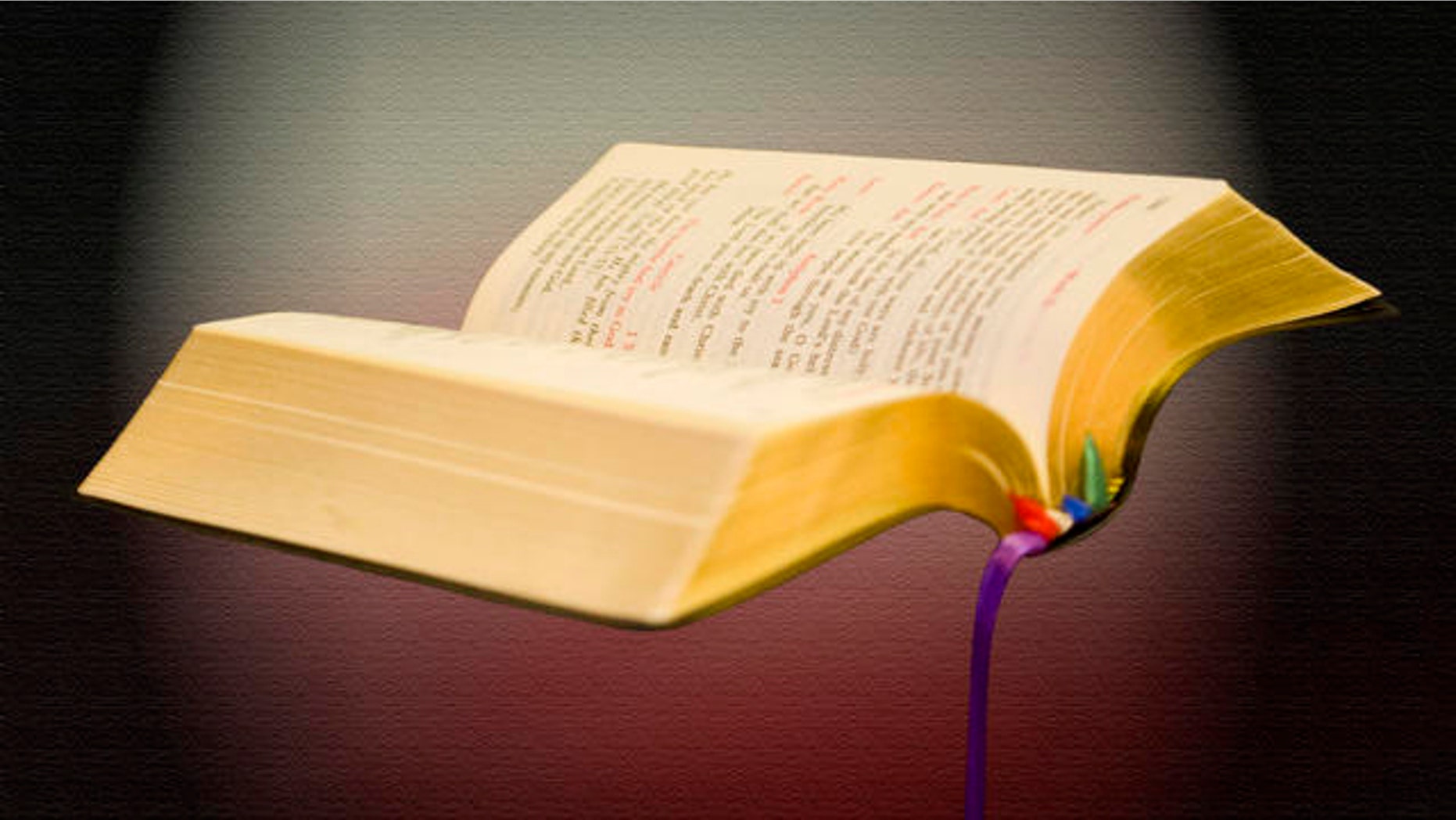 In this photo taken on April 22, 2009, Seminarian Joseph Toledo holds his bible during the morning mass at the Redemptoris Mater Archdiocesan Missionary Seminary in Denver. (AP Photo/Joel Fischer)