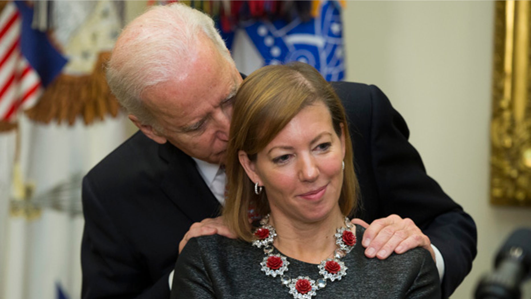 Feb. 17, 2015: Vice President Joe Biden talks with Stephanie Carter, wife of incoming Defense Secretary Ash Carter during Carter's swearing in ceremony in the Roosevelt Room of the White House in Washington.