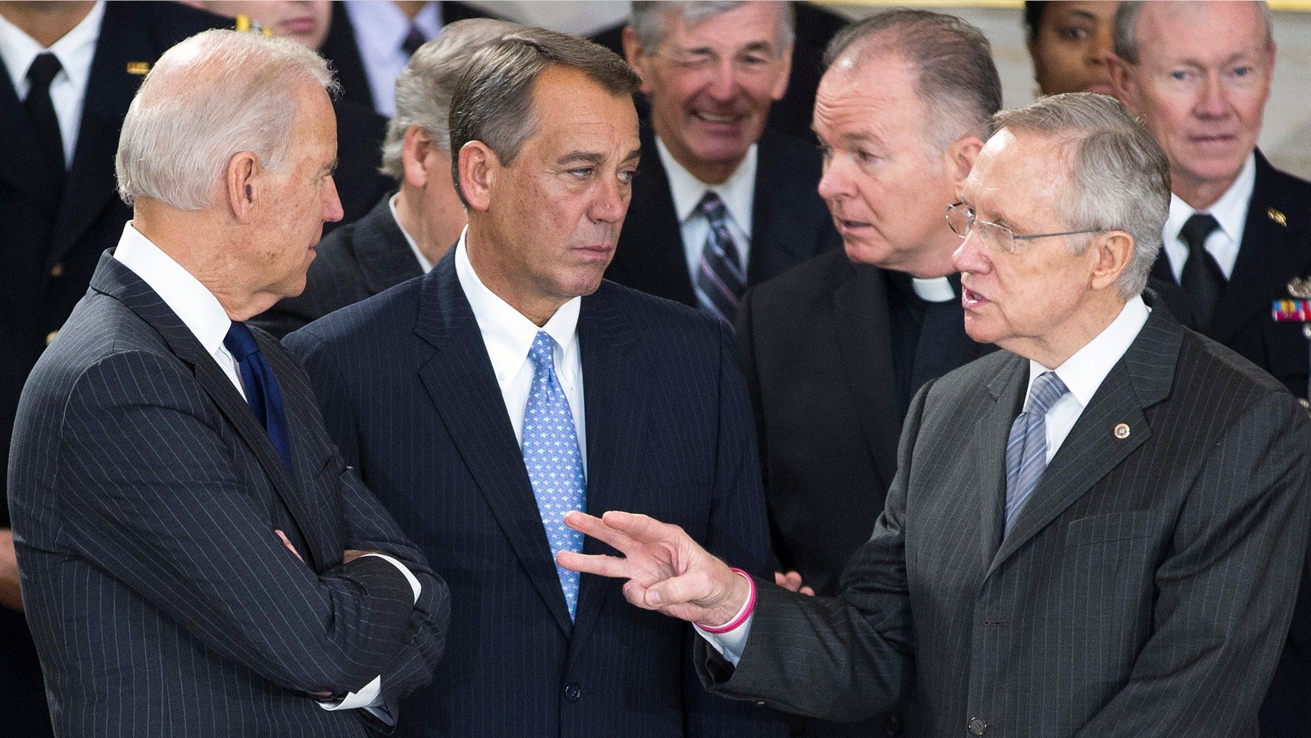 Vice President Joseph Biden, Speaker of the House John Boehner and Senate Majority Leader Harry Reid in the U.S. Capitol Rotunda in Washington on December 20, 2012.