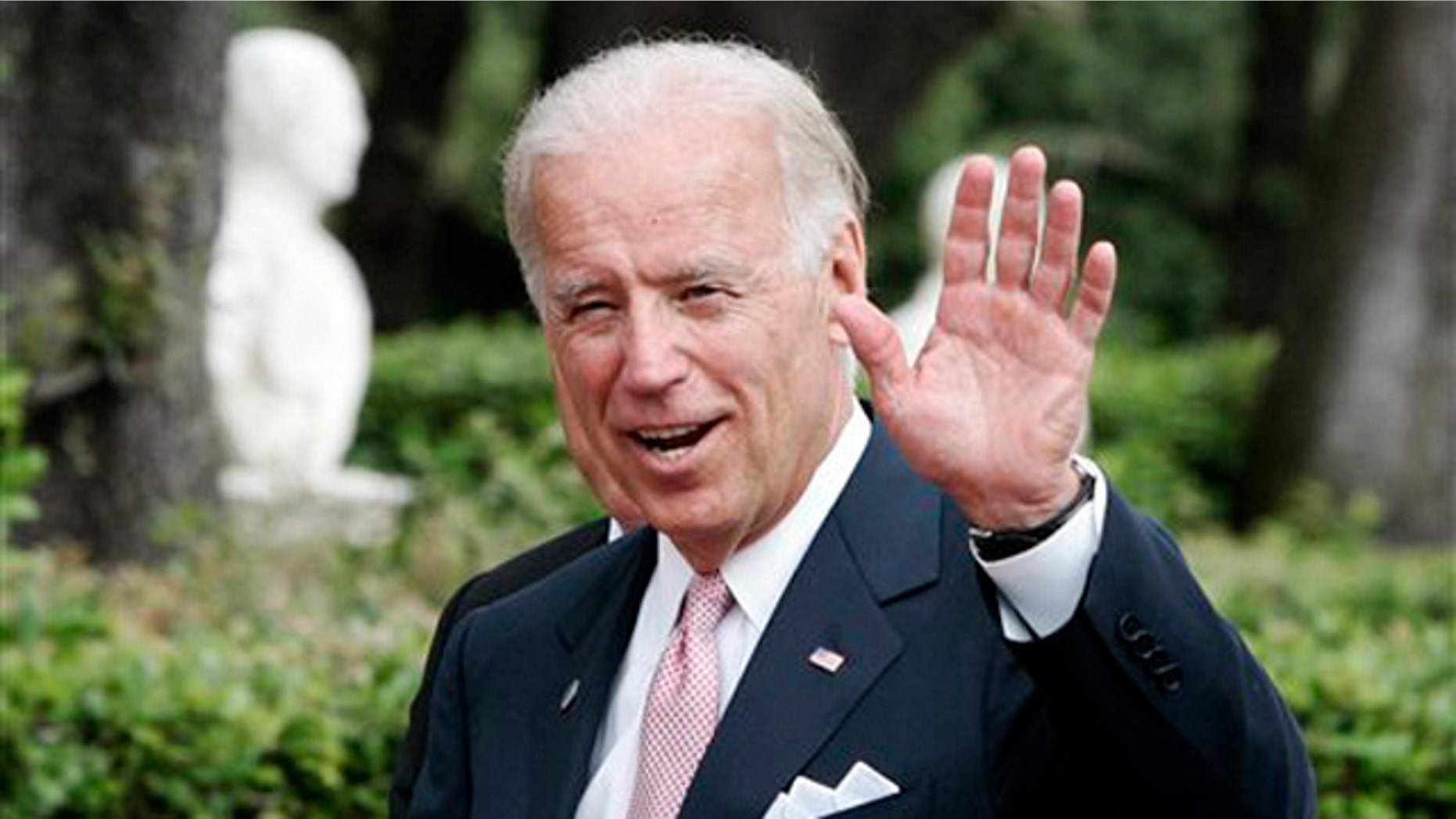 Vice President Joe Biden waves at Rome's Villa Doria Pamphili June 2.