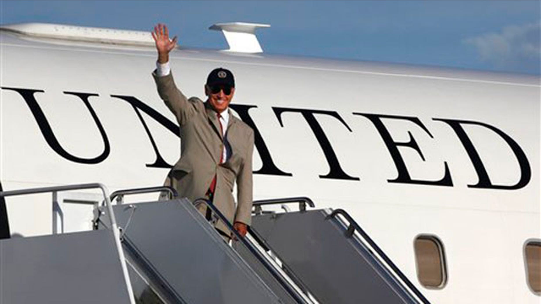 August 24: Vice President Joe Biden waves before boarding his plane at Yokota Air Base, on Tokyo's outskirts.