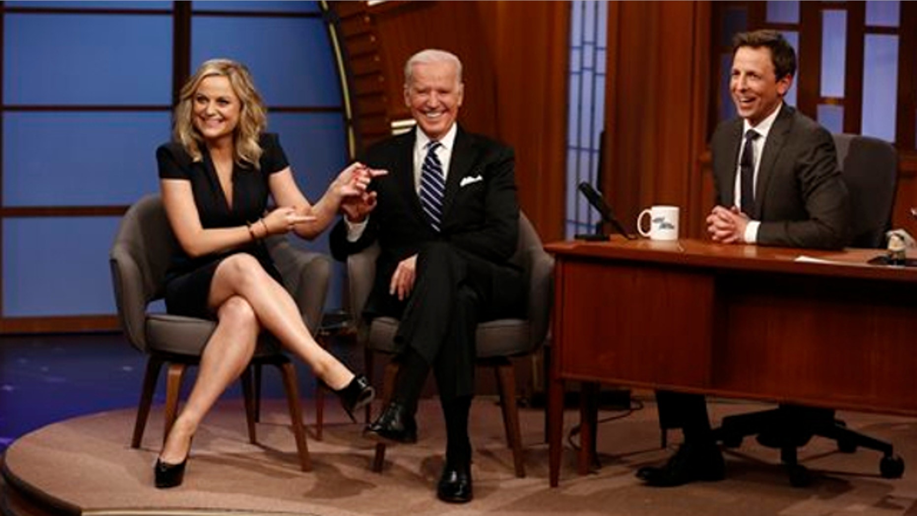 Feb. 24, 2014: In this photo provided by NBC, from left, actress Amy Poehler and Vice President Joe Biden appear with host Seth Meyers on the premiere of "Late Night with Seth Meyers" in New York.