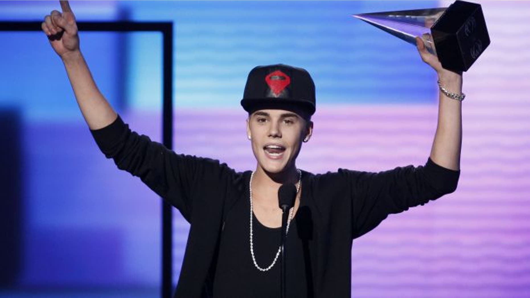 Nov. 18, 2012: Justin Bieber accepts the award for favorite pop rock album for "Believe" at the 40th American Music Awards in Los Angeles, California.