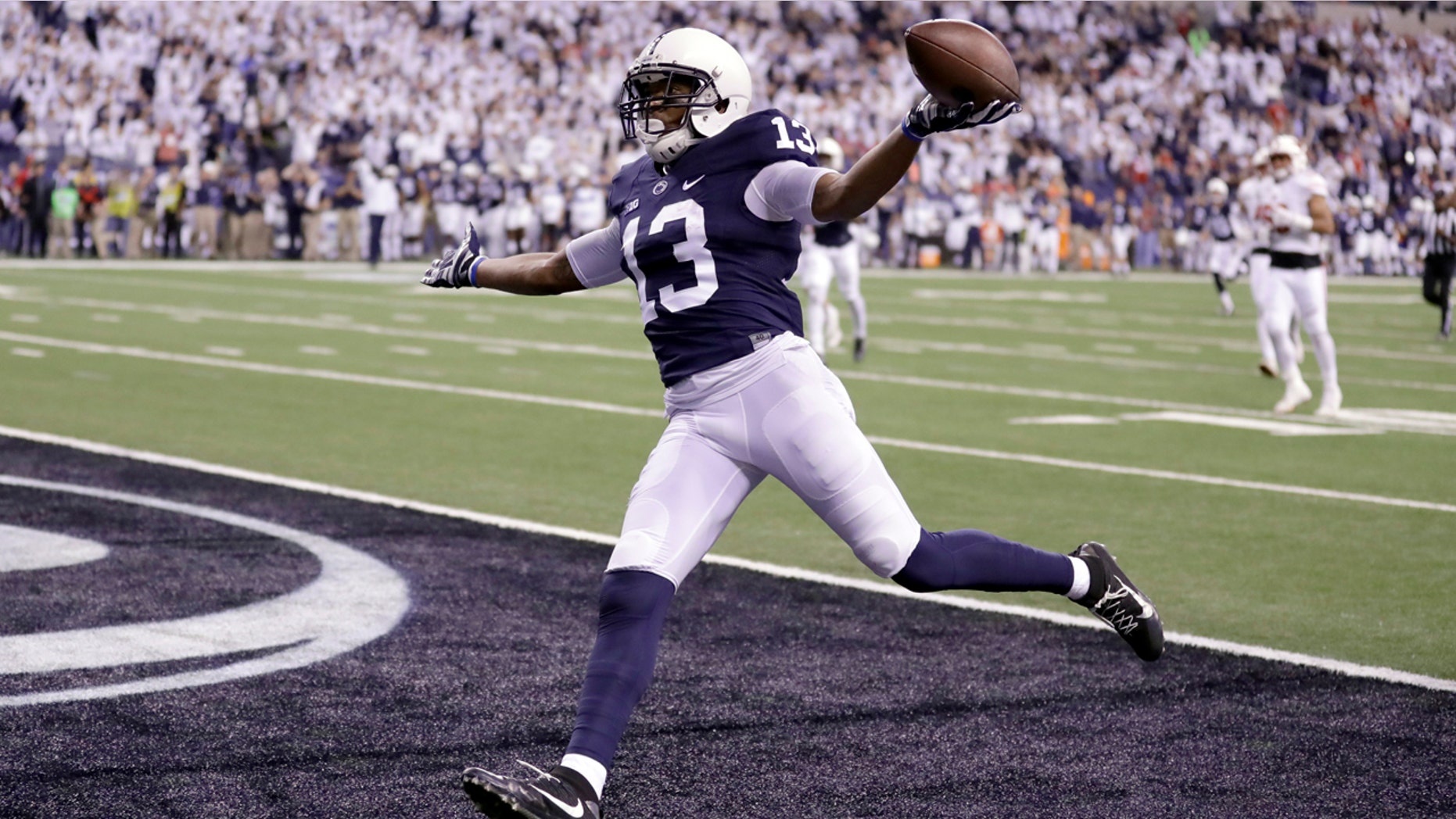 Penn State's Saeed Blacknall celebrates after scoring on a 40-yard touchdown reception during the first half of the Big Ten championship NCAA college football game against Wisconsin, Saturday, Dec. 3, 2016, in Indianapolis.