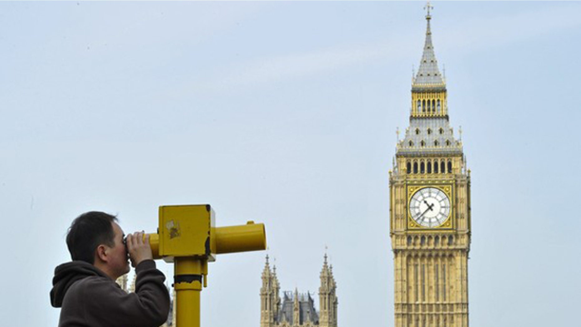 May 6: A man looks through a telescope opposite Big Ben and the Houses of Parliament, in central London.