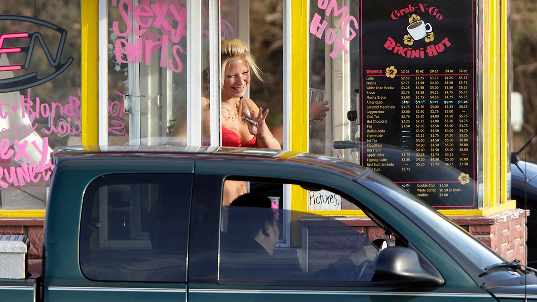 Barista at Grab-N-Go Bikini Hut, an espresso hut similar to "Hillbilly Hotties," which is suing over a new city ordinance.