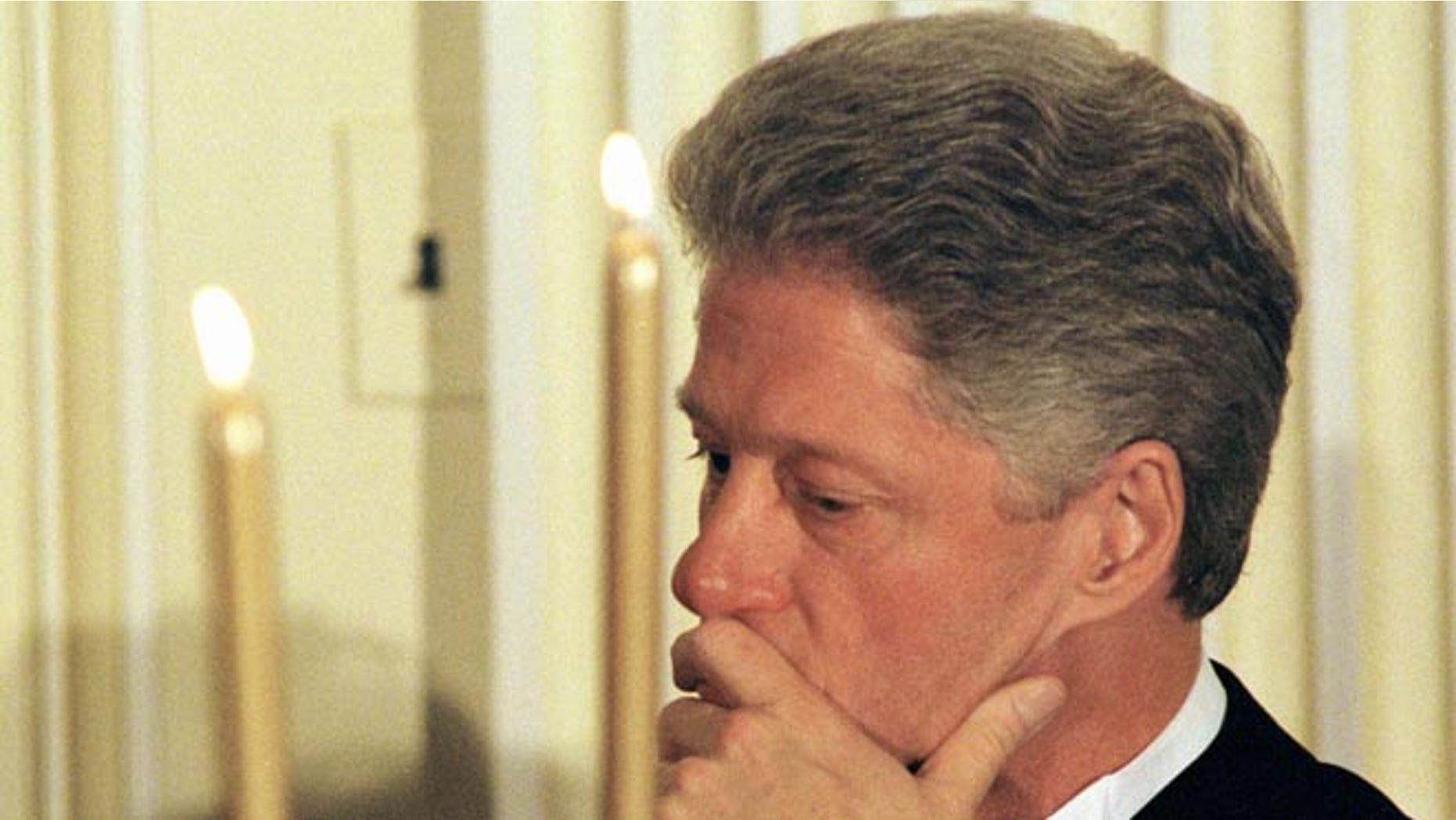 US President Bill Clinton waits his turn to speak at a dinner for the White House Endowment Fund January 21, 1998.