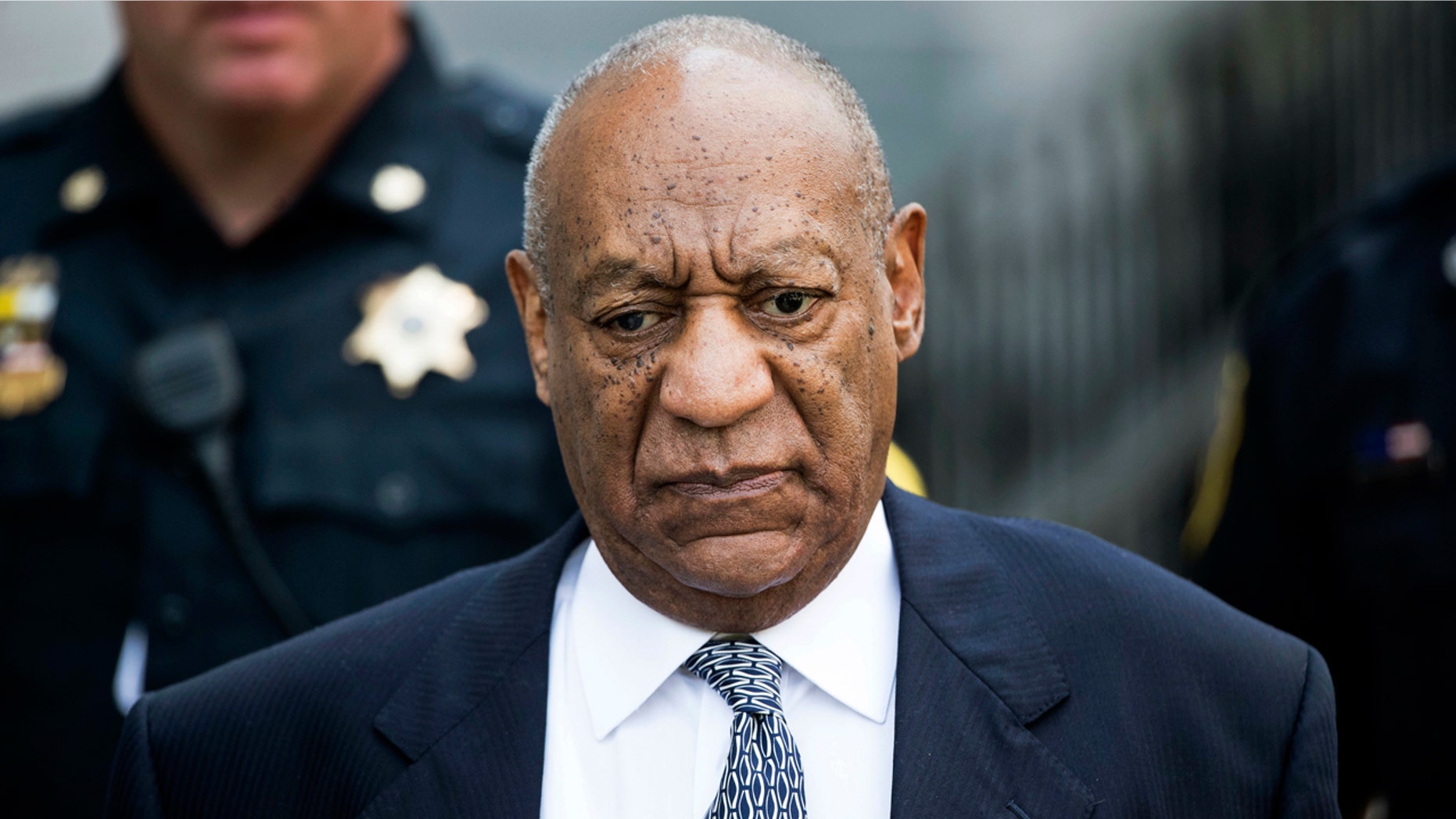 In this Aug. 22, 2017, file photo, Bill Cosby leaves Montgomery County Courthouse after a hearing in his sexual assault case in Norristown, Pa.