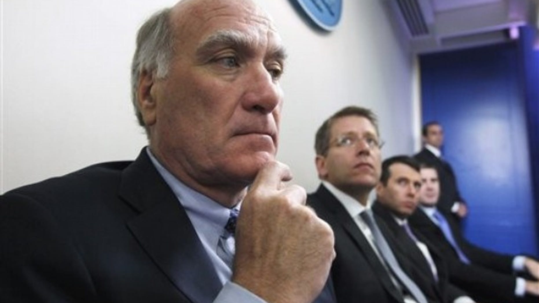 FILE: In this July, 11, 2011, photo, White House Chief of Staff William Daley and others listen as President Obama speaks in the White House press briefing room.