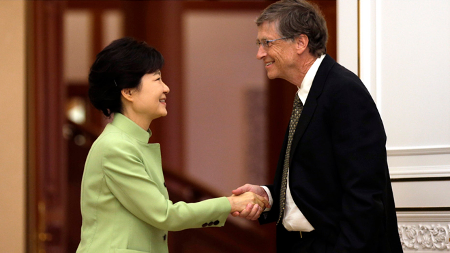 April 22, 2013: South Korean President Park Geun-hye, left, shakes hands with Microsoft founder Bill Gates before their meeting at the presidential Blue House in Seoul, South Korea.