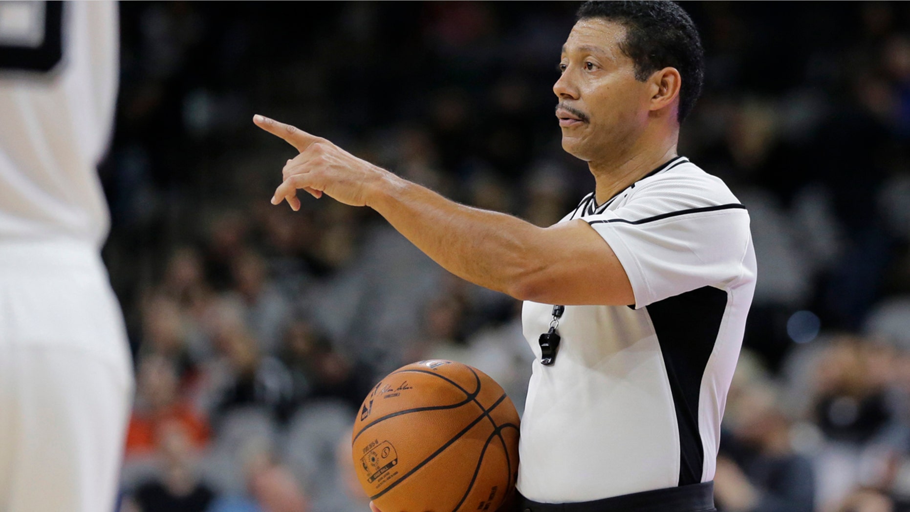 NBA referee Bill Kennedy (55) during the second half of an NBA basketball game between the San Antonio Spurs and Utah Jazz, Monday, Dec. 14, 2015, in San Antonio. Kennedy has told Yahoo Sports he is gay after Sacramento Kings guard Rajon Rondo directed a gay slur at him during a game. Kennedy tells Yahoo he is "proud to be an NBA referee and I am proud to be a gay man," adding that he chose to come out in hopes of sending a message "that you must allow no one to make you feel ashamed of who you are." (AP Photo/Eric Gay)