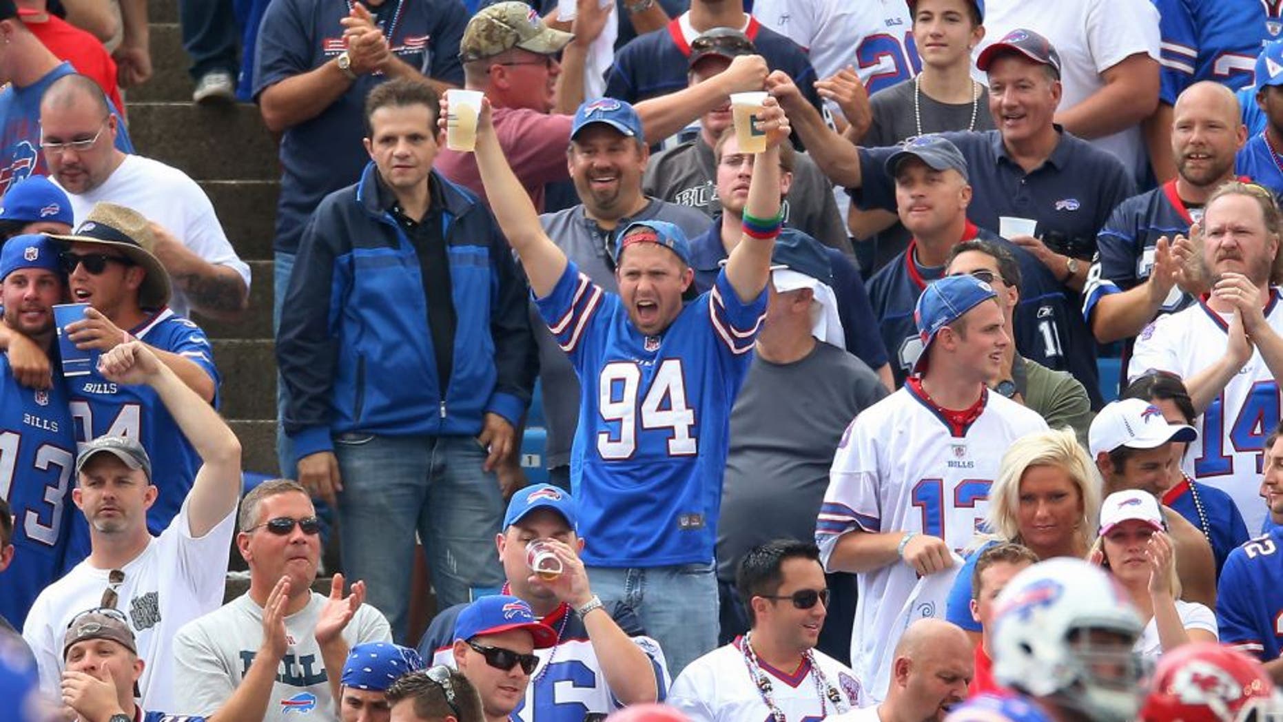 BUFFALO, NY - SEPTEMBER 16: Fans of the Buffalo Bills celebrate a touchdown during an NFL game against the Kansas City Chiefs at Ralph Wilson Stadium on September 16, 2012 in Orchard Park, New York. (Photo by Tom Szczerbowski/Getty Images)