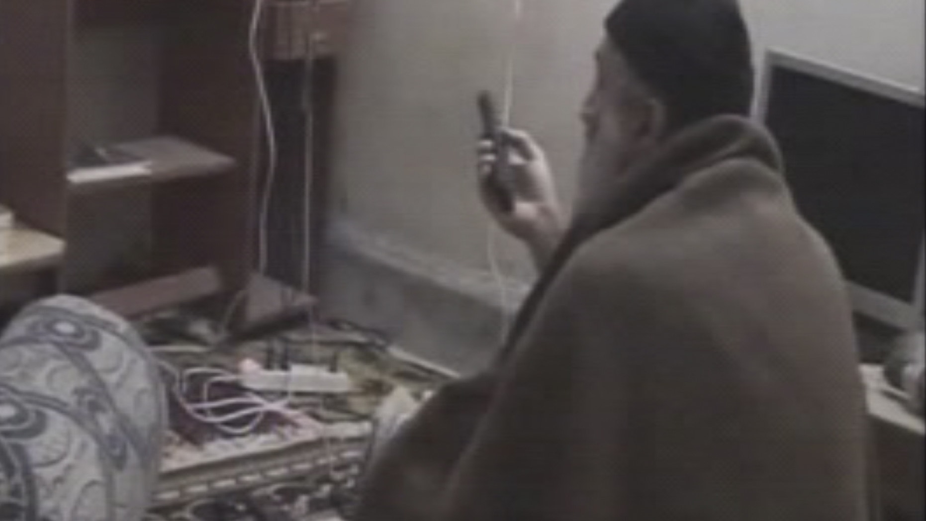 In this undated image taken from video provided by U.S. intelligence officials, a man who the American government says is Usama bin Laden watches television in a video released on Saturday, May 7, 2011.