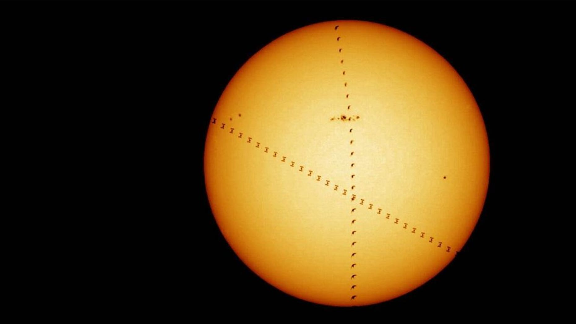 A bird (flying up the center of the image) crosses the face of the sun at the same time as the International Space Station (diagonal path) in this composite image released Oct. 4, 2017, by the European Space Agency. The astronomy club at the agency's European Space Astronomy Centre near Madrid, Spain, took the photo in 2013.