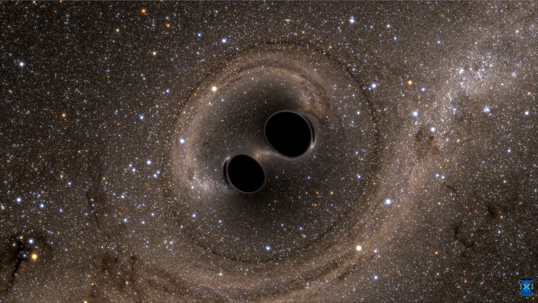 File photo: The collision of two black holes - a tremendously powerful event detected for the first time ever by the Laser Interferometer Gravitational-Wave Observatory, or LIGO - is seen in this still image from a computer simulation released in Washington February 11, 2016. (REUTERS/The SXS (Simulating eXtreme Spacetimes)/Handout via Reuters)
