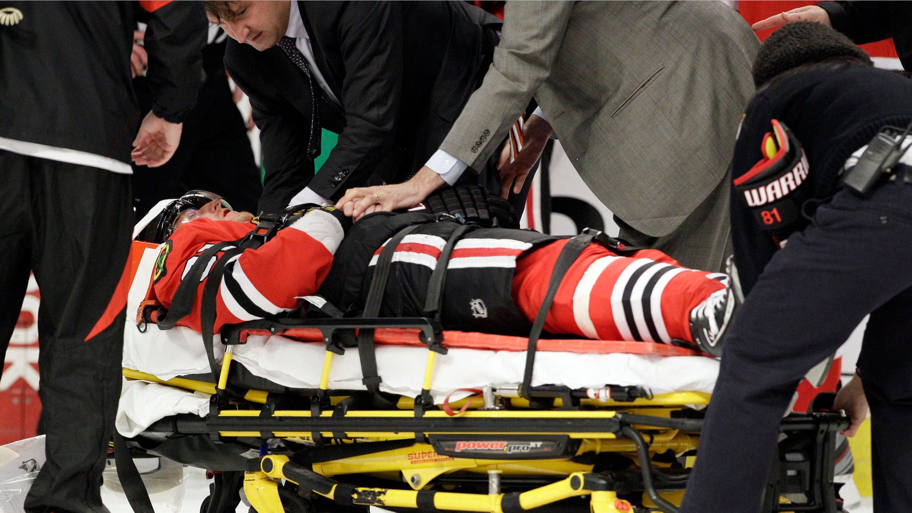 Chicago Blackhawks' Marian Hossa (81) of Slovakia, leaves the game after a hit from Phoenix Coyotes' Raffi Torres (37) during the first period of Game 3 of an NHL hockey Stanley Cup first-round playoff series in Chicago, Tuesday, April 17, 2012. (AP Photo/Nam Y. Huh)