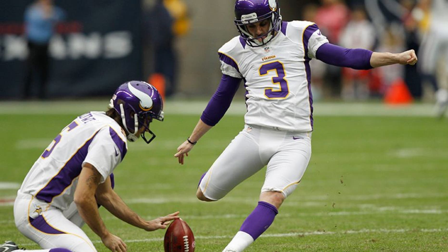 HOUSTON, TX - DECEMBER 23: Blair Walsh #3 of the Minnesota Vikings kicks a field goal during practice out of the hold of Chris Kluwe #5 of the Minnesota Vikings against the Minnesota Vikings at Reliant Stadium on December 23, 2012 in Houston, Texas. Minnesota Vikings defeat the Houston Texans 23-6. (Photo by Bob Levey/Getty Images)