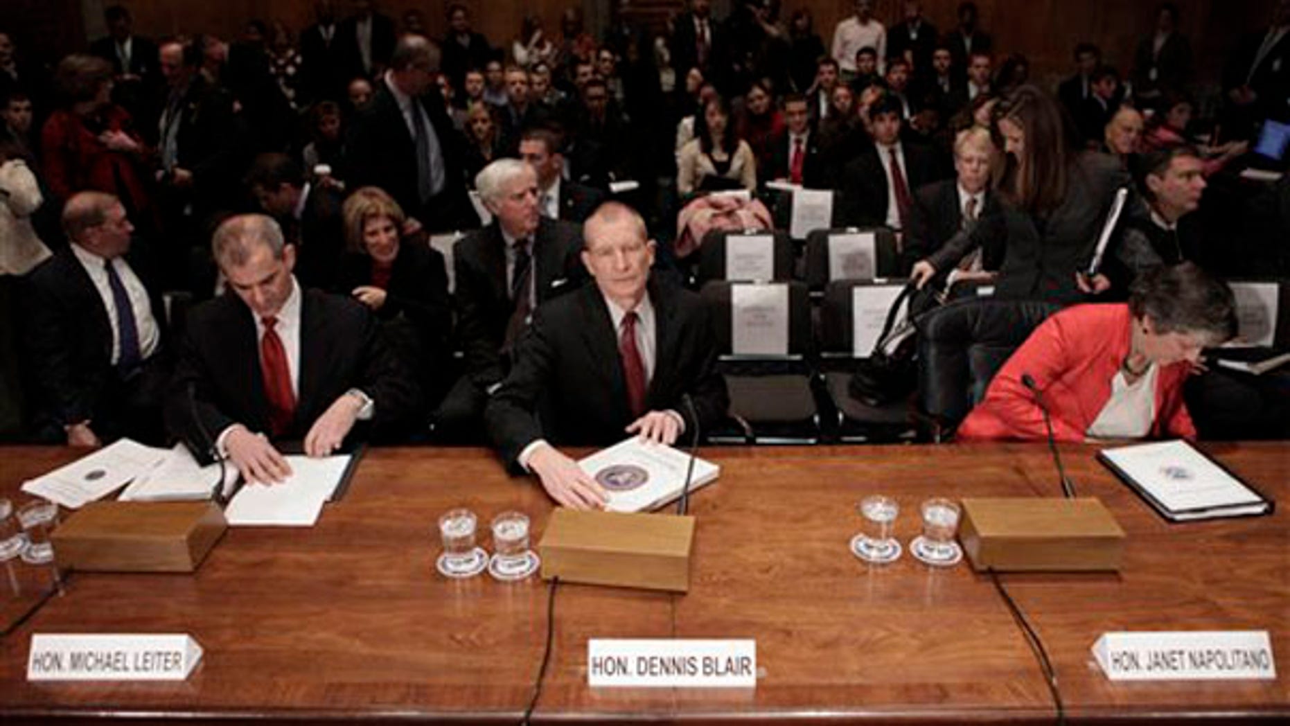 From left, National Counterterrorism Center Directir Michael Leiter, Director of National Intelligence Dennis Blair, and Homeland Security Secretary Janet Napolitano take their seats before testifying on Capitol Hill Jan. 20. (AP Photo)