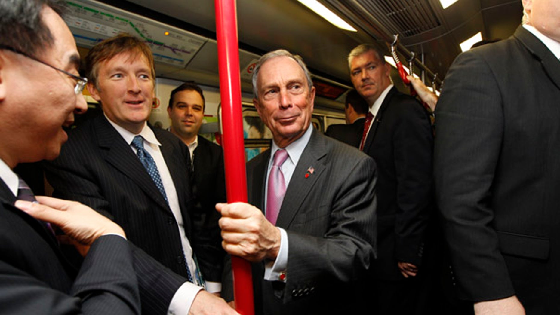 FILE: In this Nov. 6 picture, New York City Mayor Michael Bloomberg rides on the Mass Transit Railway, an underground train in Hong Kong, during a convention of large city leaders who met to discuss climate change.