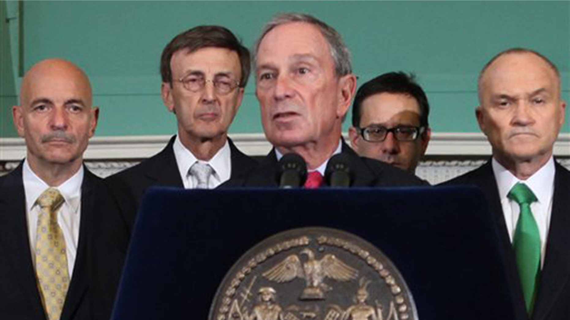 New York City Mayor Michael Bloomberg, center, addresses the media Aug. 25 in New York.