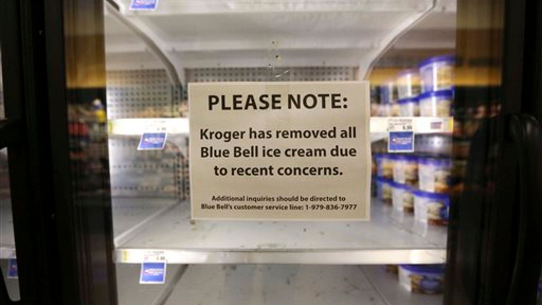 A sign explains why shelves sit empty of Blue Bell ice cream at a grocery store in Dallas, Tuesday, April 21, 2015.(AP Photo/LM Otero)