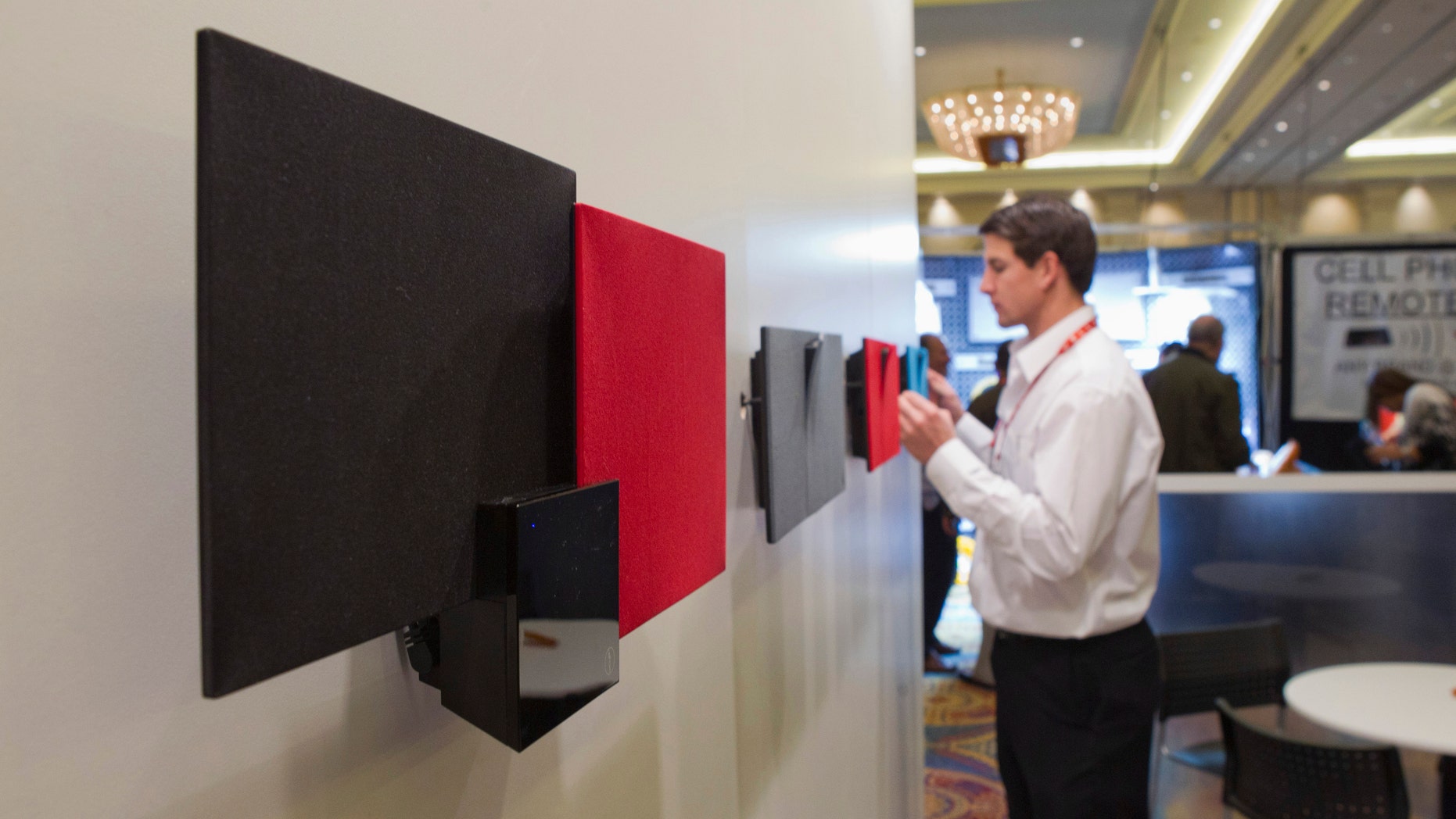 Bluetooth speakers using electrostatic loudspeaker (ESL) technology are displayed in the In2uit booth during the Consumer Electronics Show (CES) in Las Vegas January 9, 2013. (REUTERS/Steve Marcus)