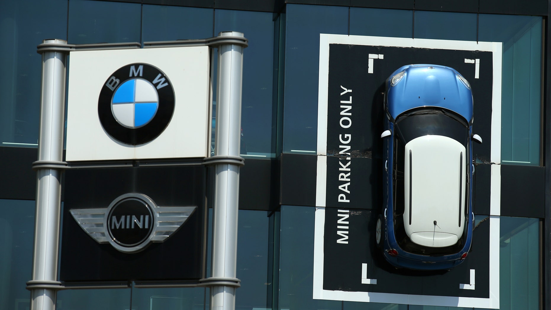 File photo: A Mini car is fixed onto a wall at a BMW and Mini dealership in Barcelona, Spain June 2, 2017. (REUTERS/Albert Gea)