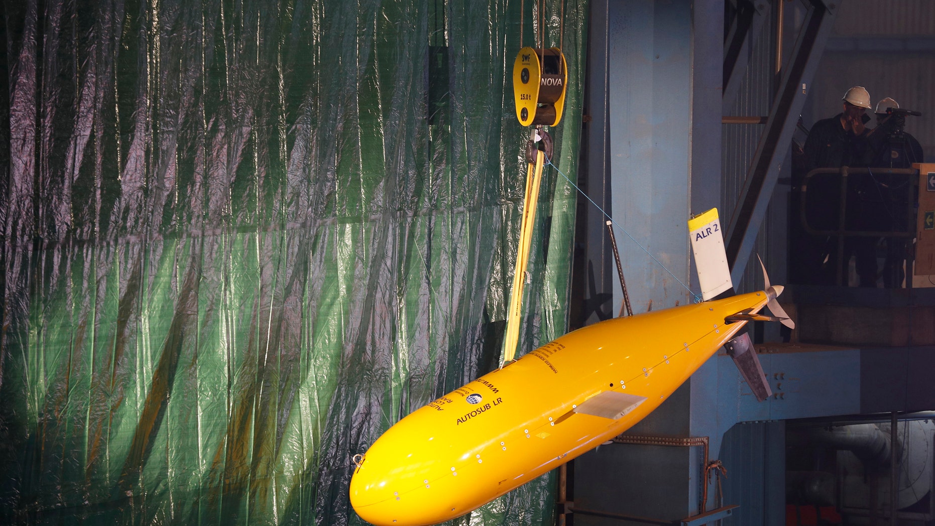 Sub 'Boaty McBoatface' hangs from a crane during the keel laying ceremony of the polar research vessel the Sir David Attenborough, at the Cammell Laird ship yard in Birkenhead, Oct. 17 , 2016. (REUTERS/Phil Noble)