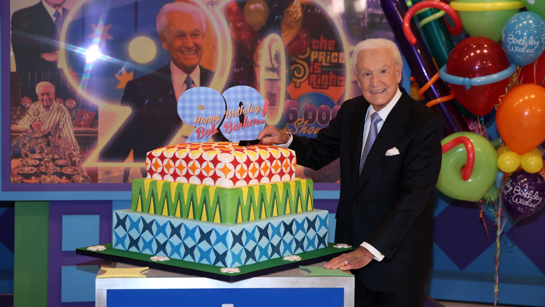 November 5, 2013. Bob Barker posing on the set of "The Price is Right" with a cake celebrating his 90th birthday at CBS Studios in Los Angeles. The veteran game show host, at the helm of The Price is Right from 1972 to 2007, was invited back by current host Drew Carey on Thursday, Dec. 12, to celebrate the milestone birthday.
