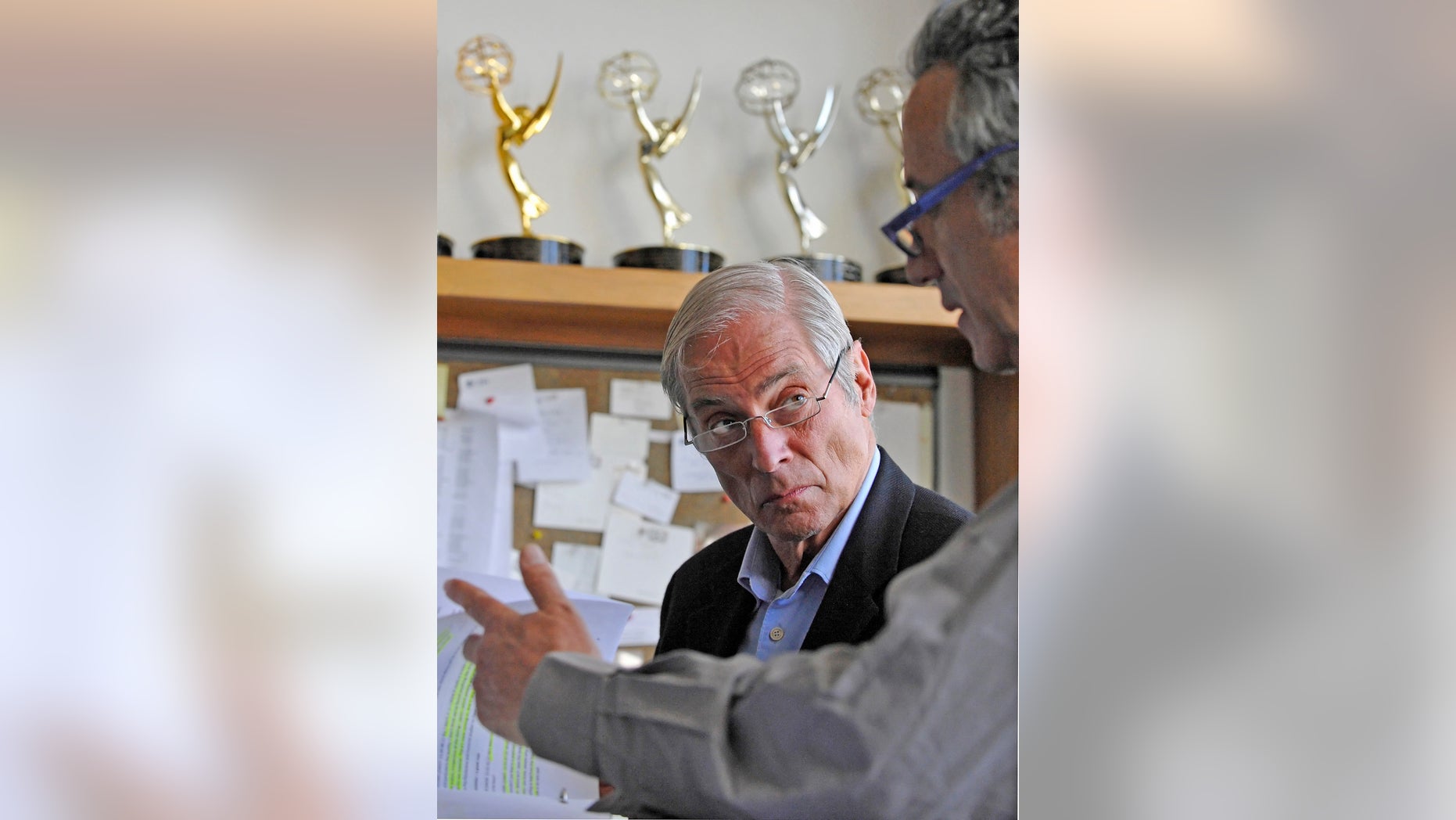 March 24, 2010. Bob Simon, speaks with a news producer at the CBS Broadcast Center in New York.