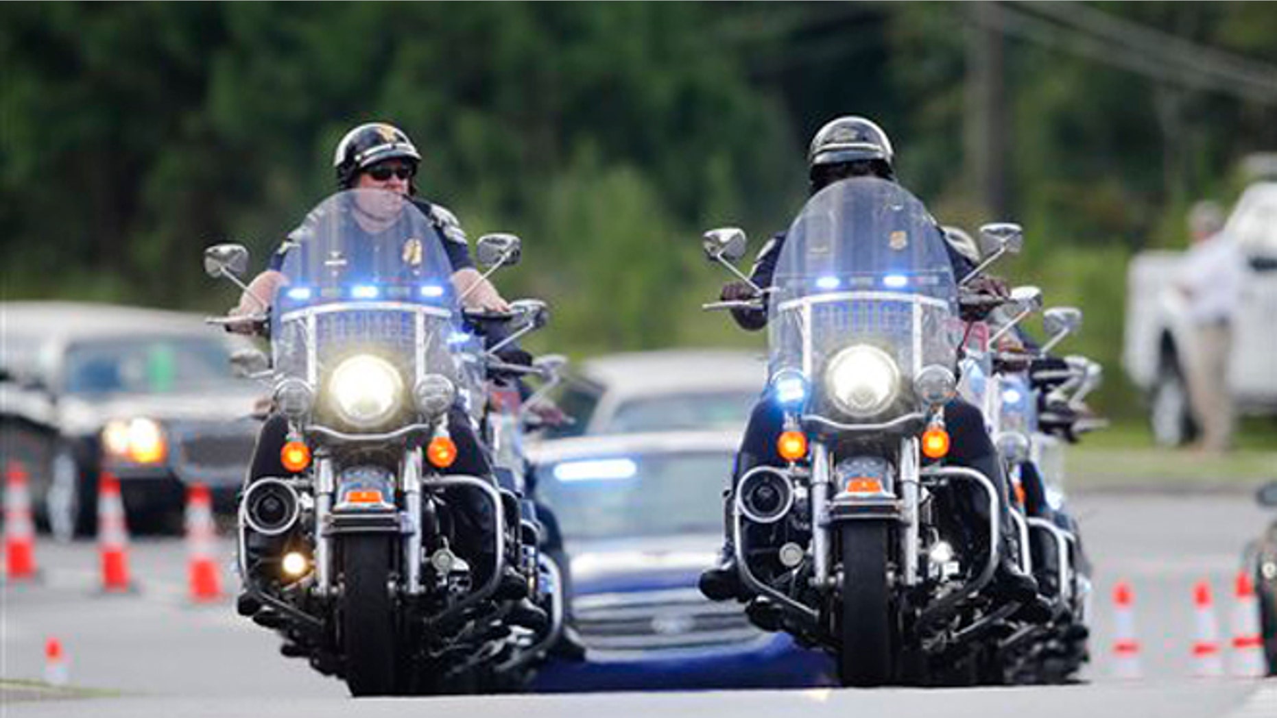 Aug. 1, 2015: Police officers on motorcycles led a procession of mourners to a funeral for Bobbi Kristina Brown in Alpharetta, Ga.